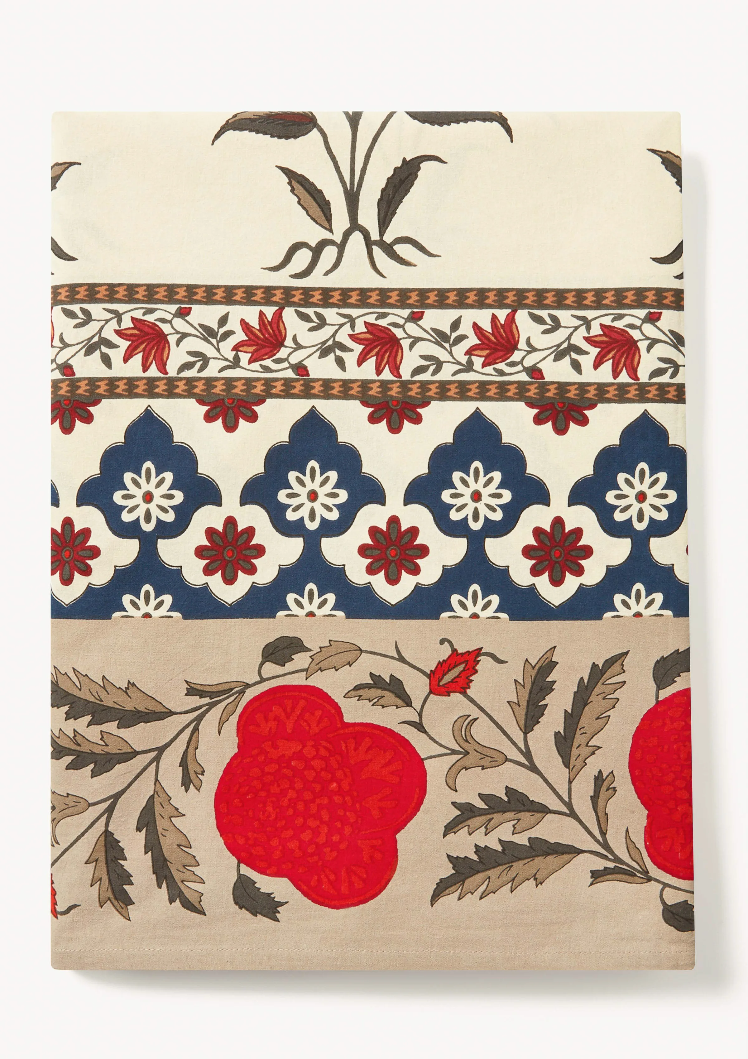 Folded block-print tablecloth with red poppies, navy arches and floral borders on a white background, for Rhode.