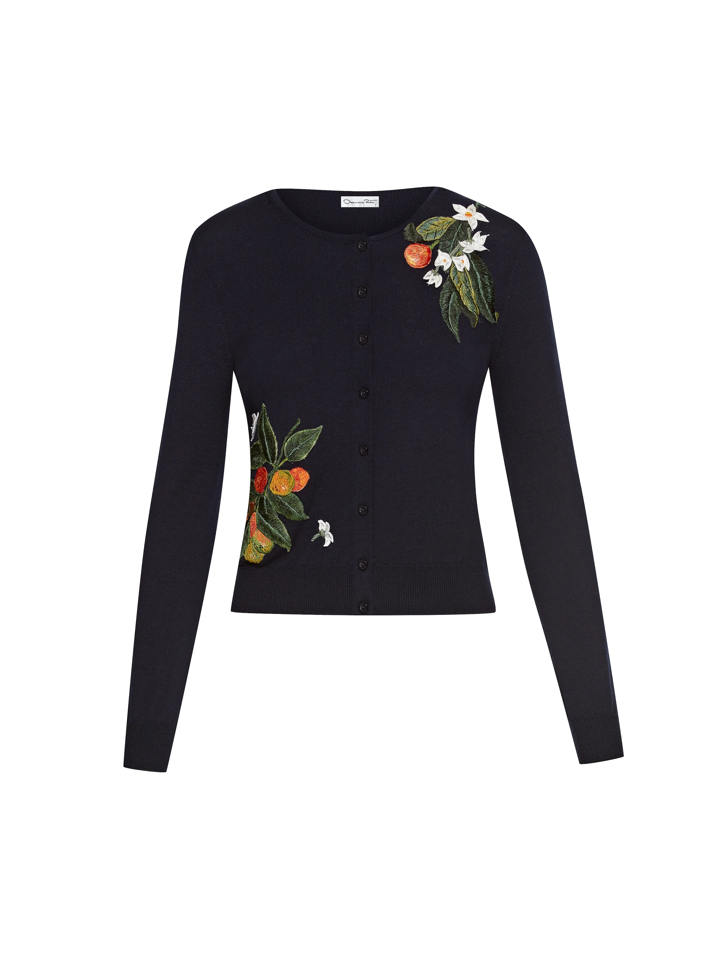 Navy knit cardigan with embroidered oranges, leaves and white blossoms on a white background, for Oscar de la Renta.