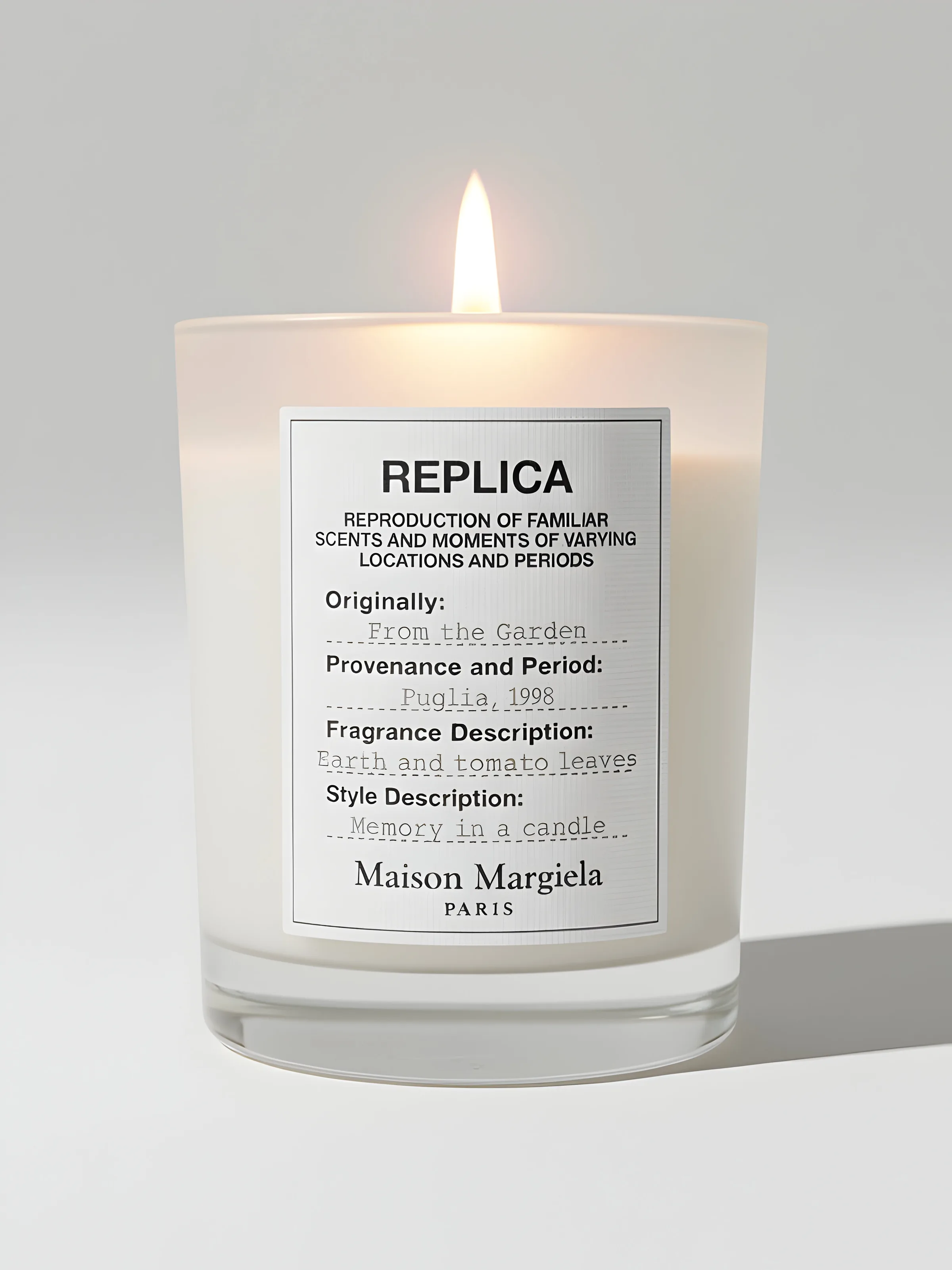 AI image of a lit Replica From the Garden candle in a frosted glass on a pale grey background. Maison Margiela AI Concept.