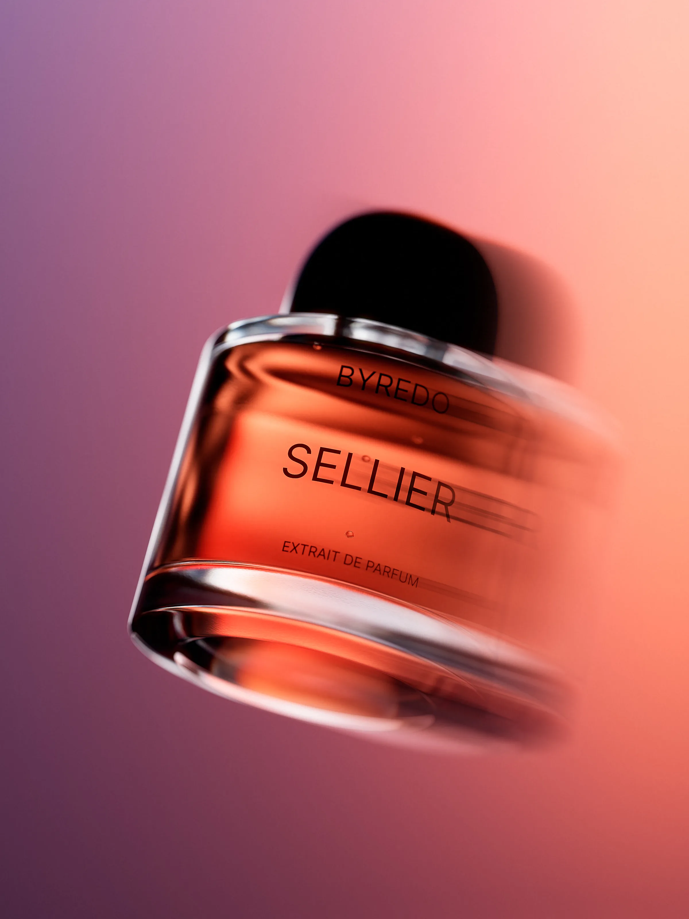 CGI render of a tilted Sellier extrait de parfum bottle with motion blur on a pink-to-purple gradient, for Byredo.