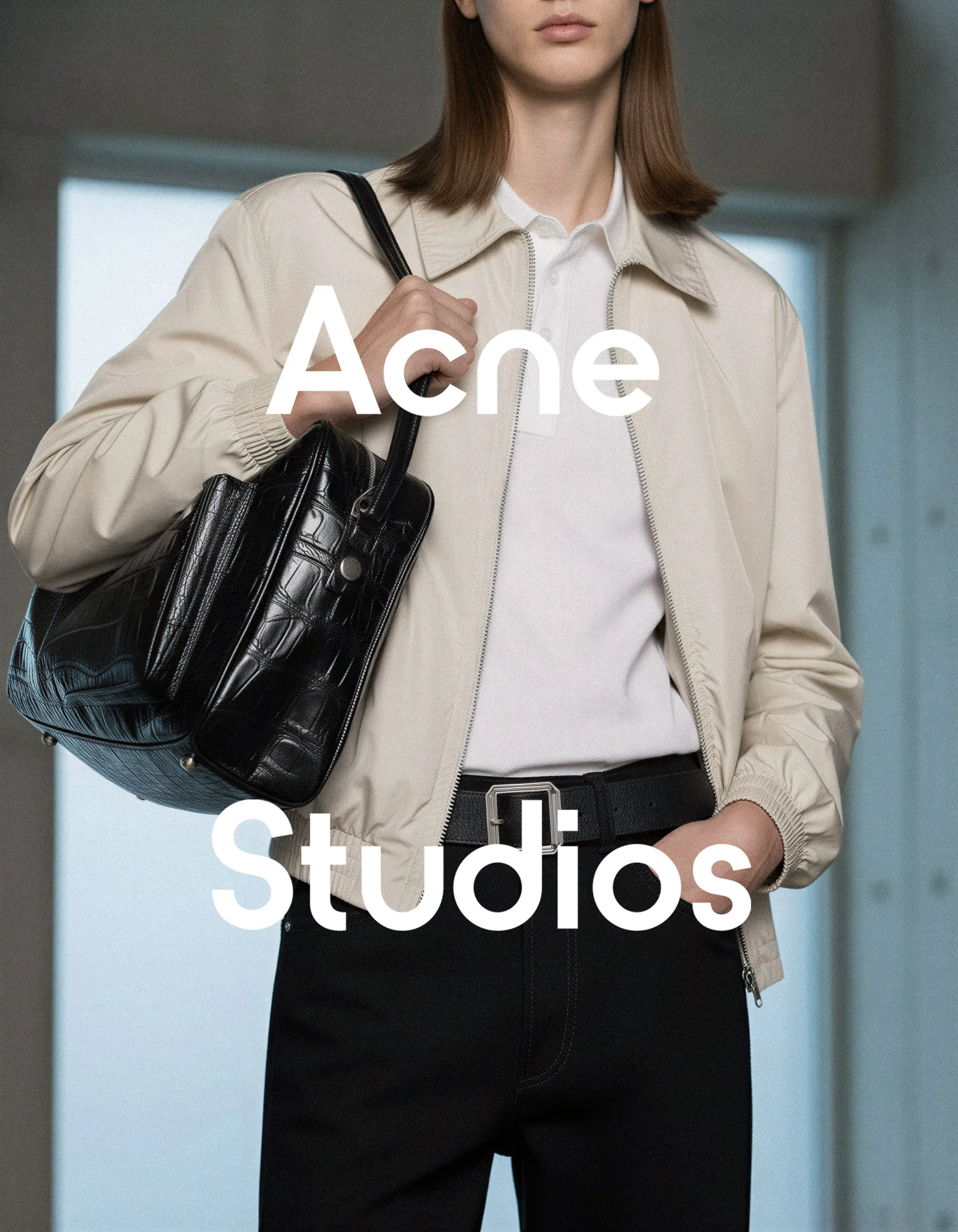 AI image of a model in a beige zip jacket and black jeans carrying a black croc-embossed bag. Acne Studios AI Concept.