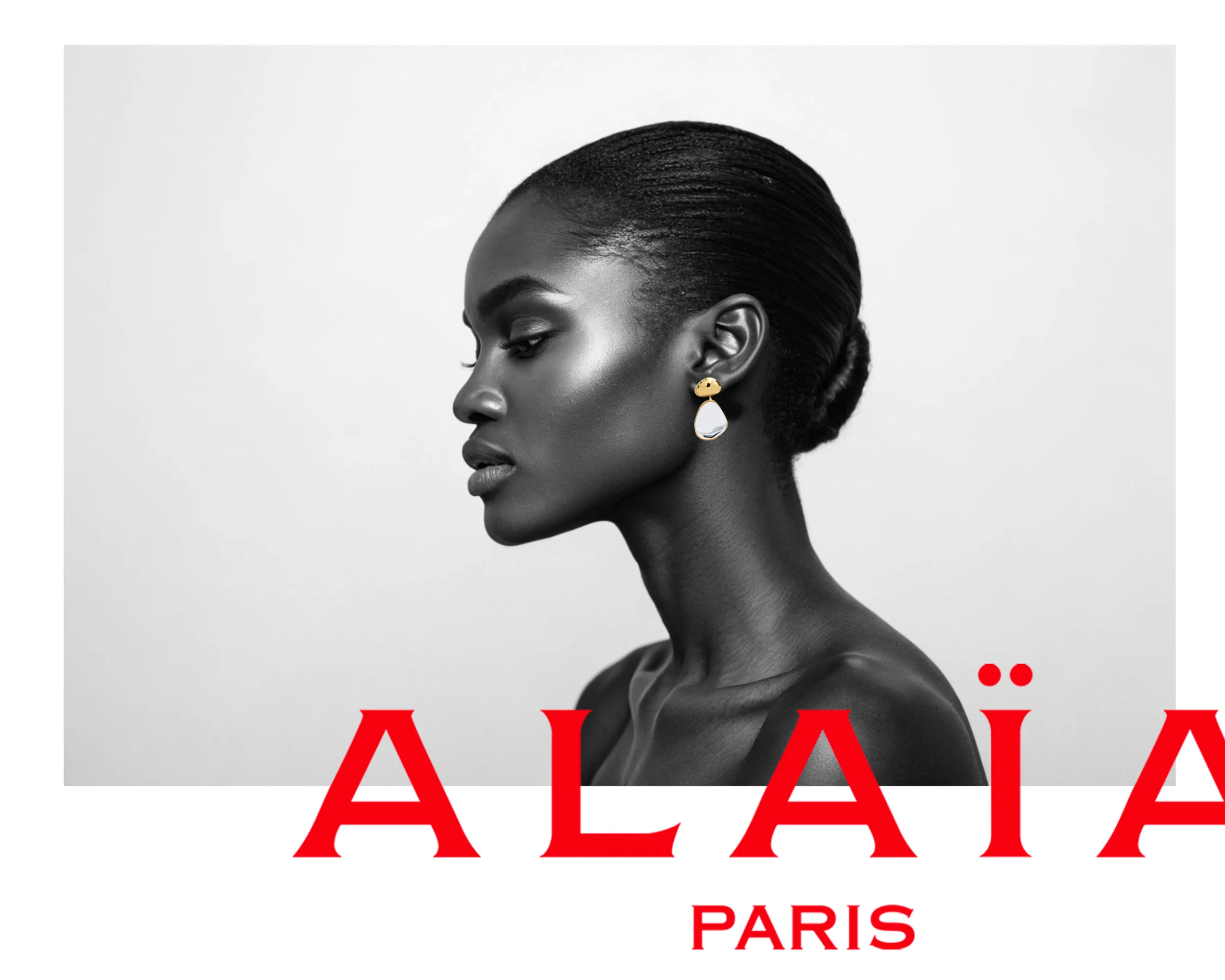 AI image of a woman in black-and-white profile wearing a gold and pearl drop earring above a red ALAÏA Paris logo. Alaïa AI Concept.