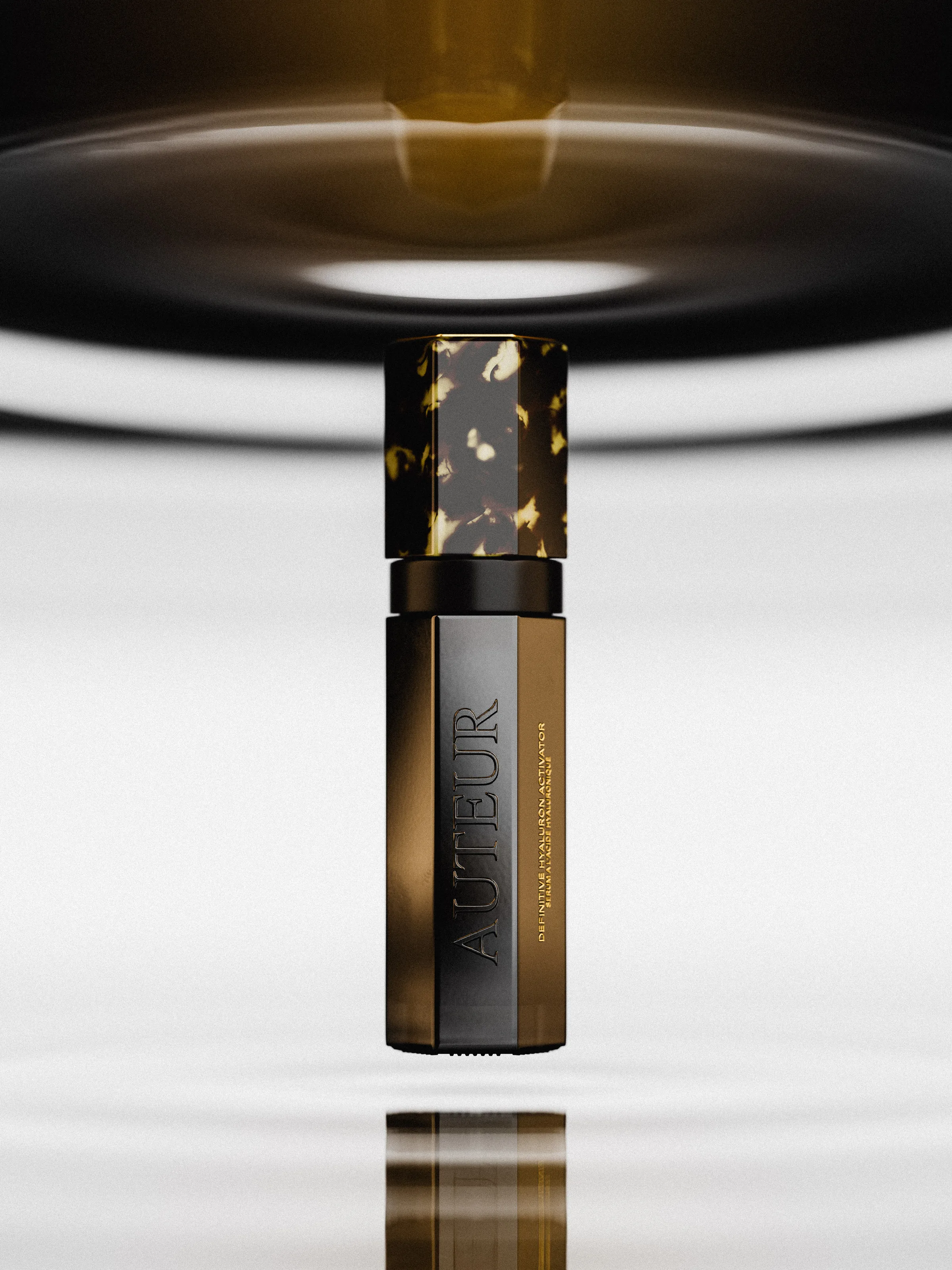 CGI render of a bronze serum bottle with tortoiseshell cap floating above rippling liquid, for Auteur.