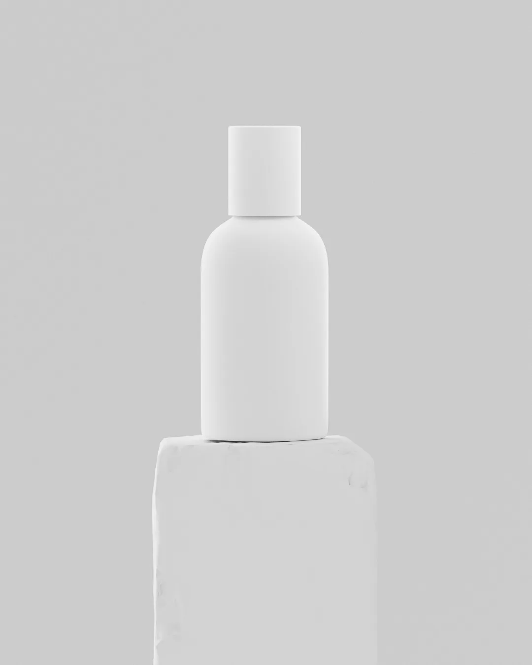CGI render of a matte white bottle standing on a rough white plaster plinth against a pale grey backdrop, for Aesop.