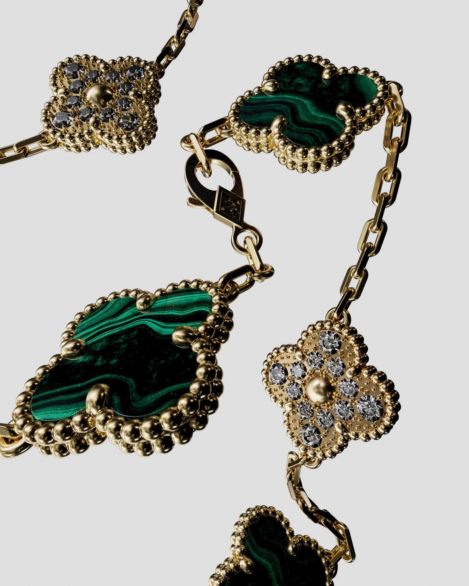 CGI render of a gold clover necklace with malachite and diamond motifs on a pale grey background, for Van Cleef & Arpels.