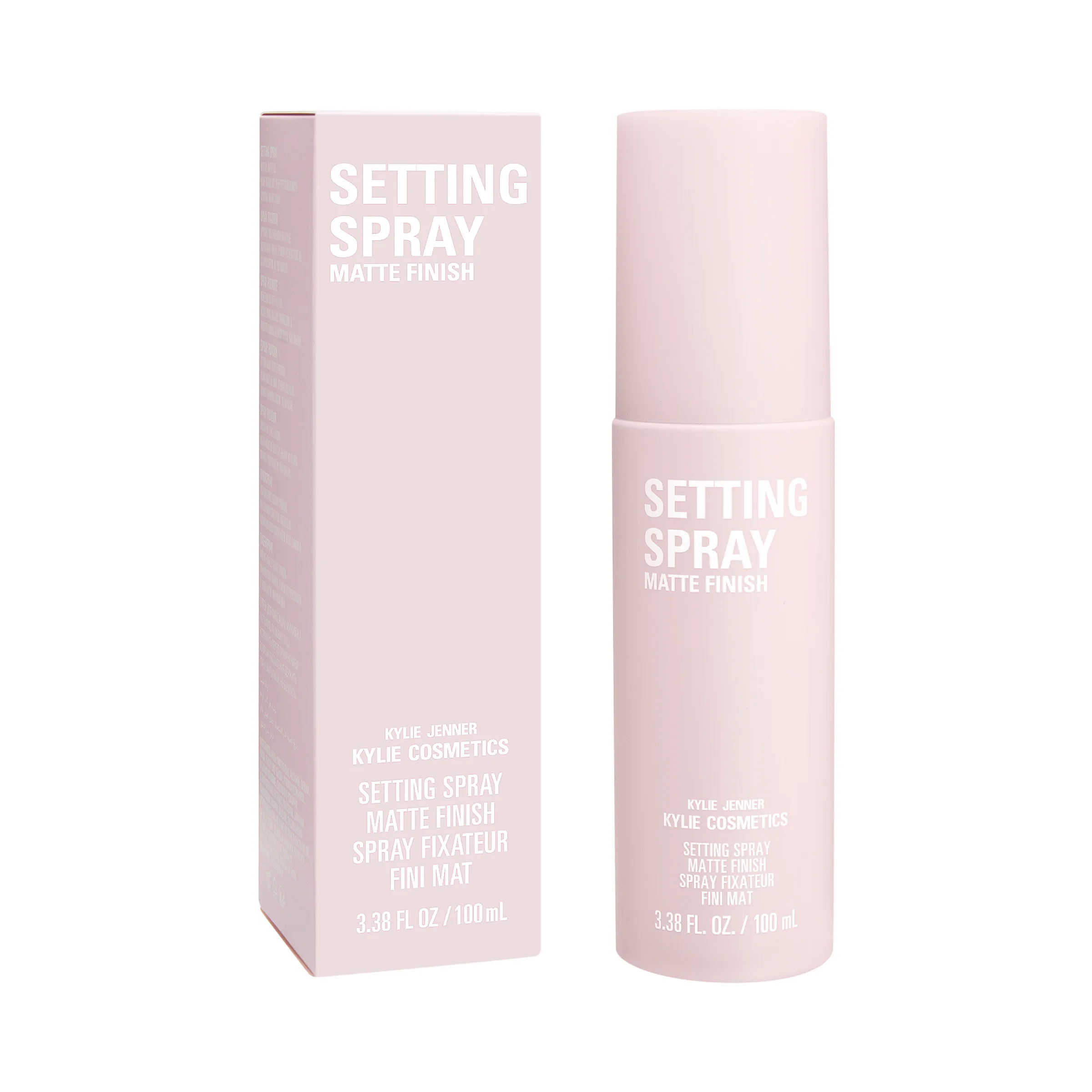 Pale pink matte finish setting spray bottle beside its matching box on a white background, for Kylie Cosmetics.