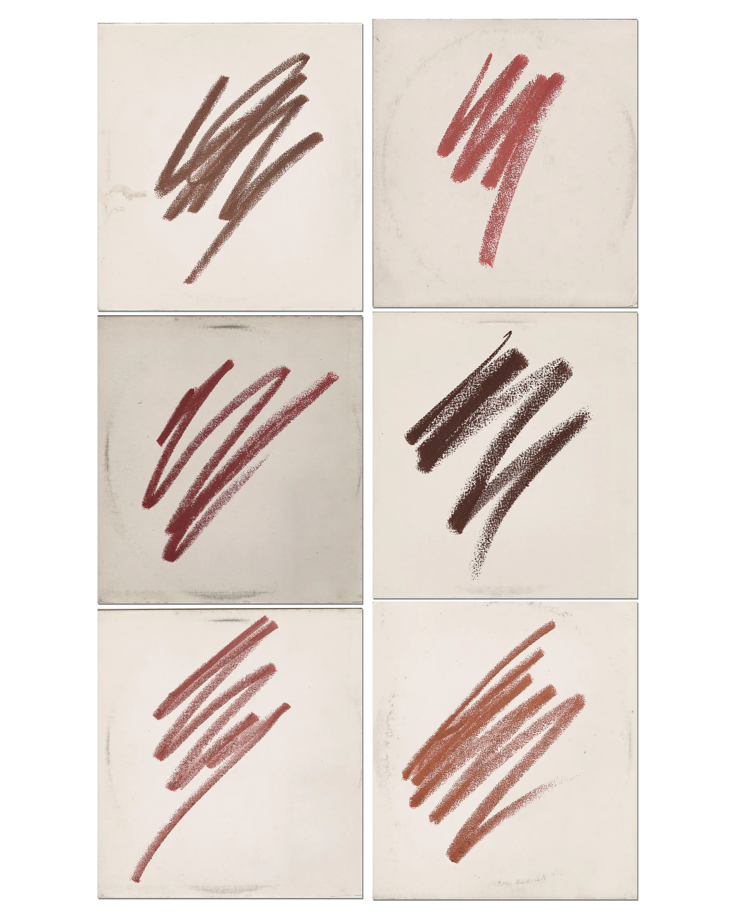 Six lip liner swatches in brown, red and nude shades scribbled on worn white record sleeves, for Kylie Cosmetics.
