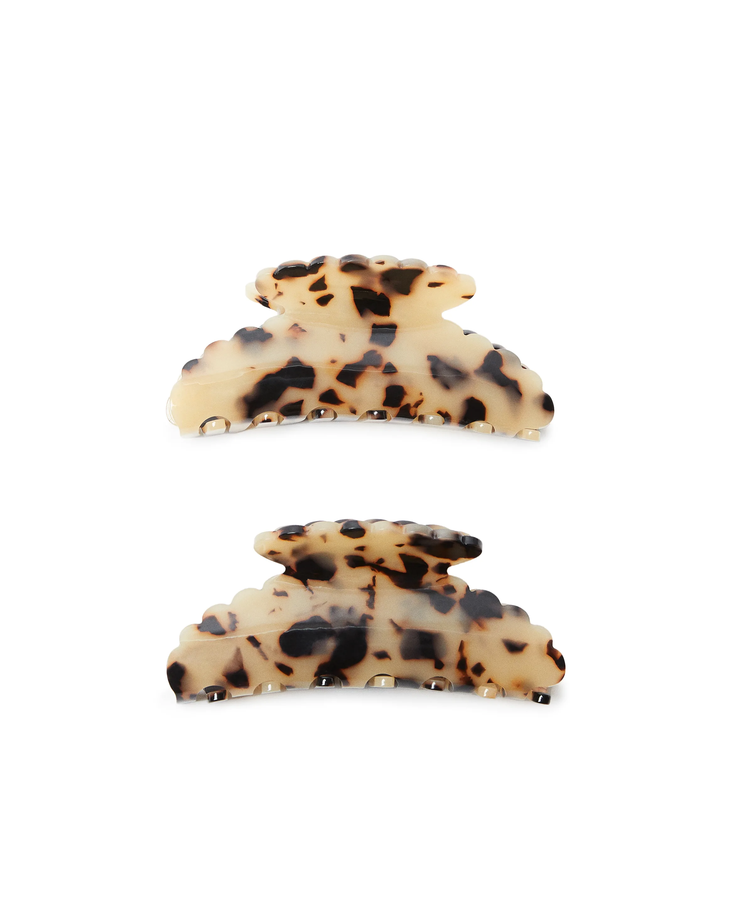 Two cream and brown tortoiseshell claw hair clips with scalloped edges on a white background, for Loeffler Randall.
