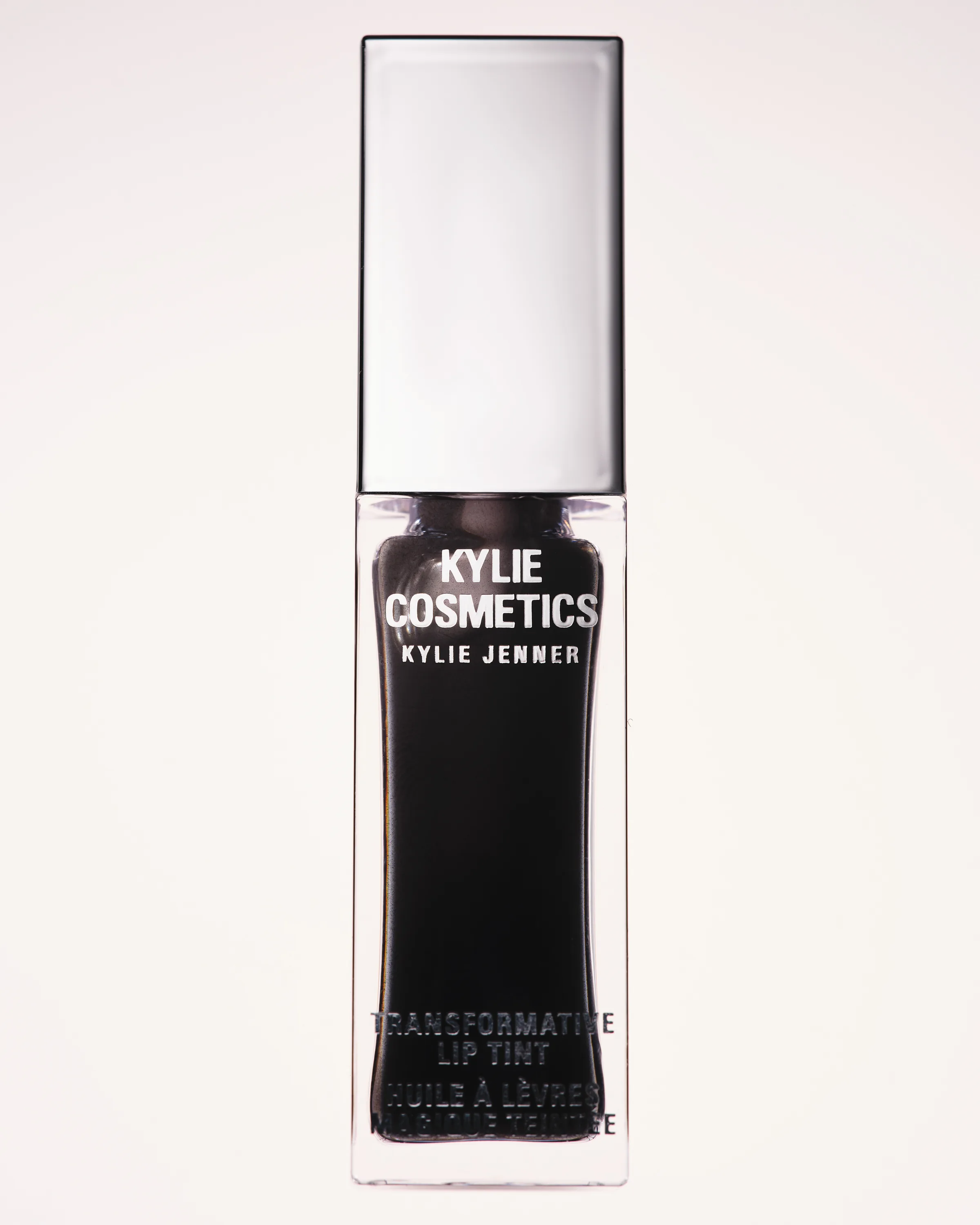 Black Noir Transformative Lip Tint bottle with silver cap on a plain white background, for Kylie Cosmetics.