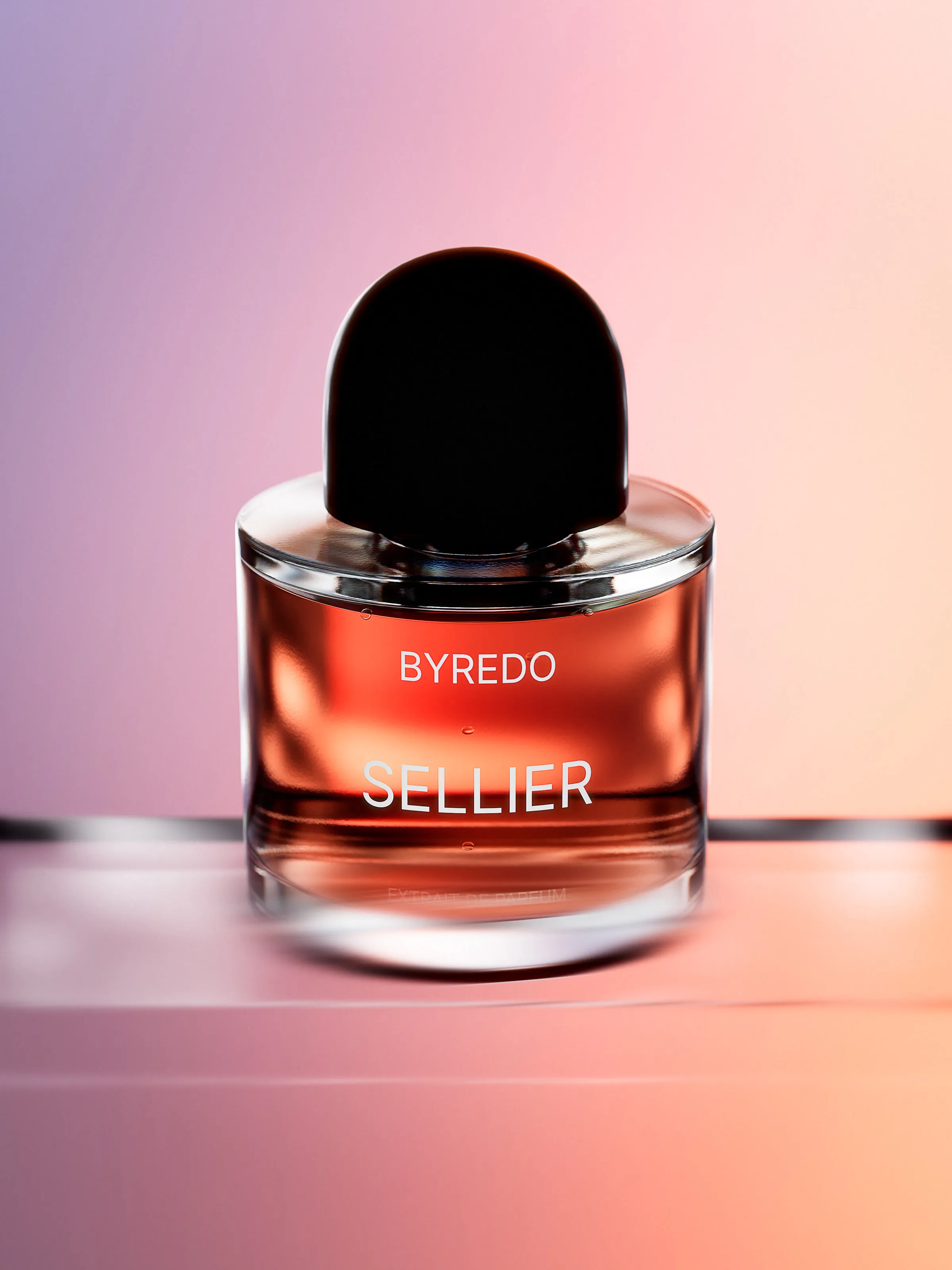 CGI render of a Sellier perfume bottle with amber liquid and black cap on a pink-to-violet gradient, for Byredo.