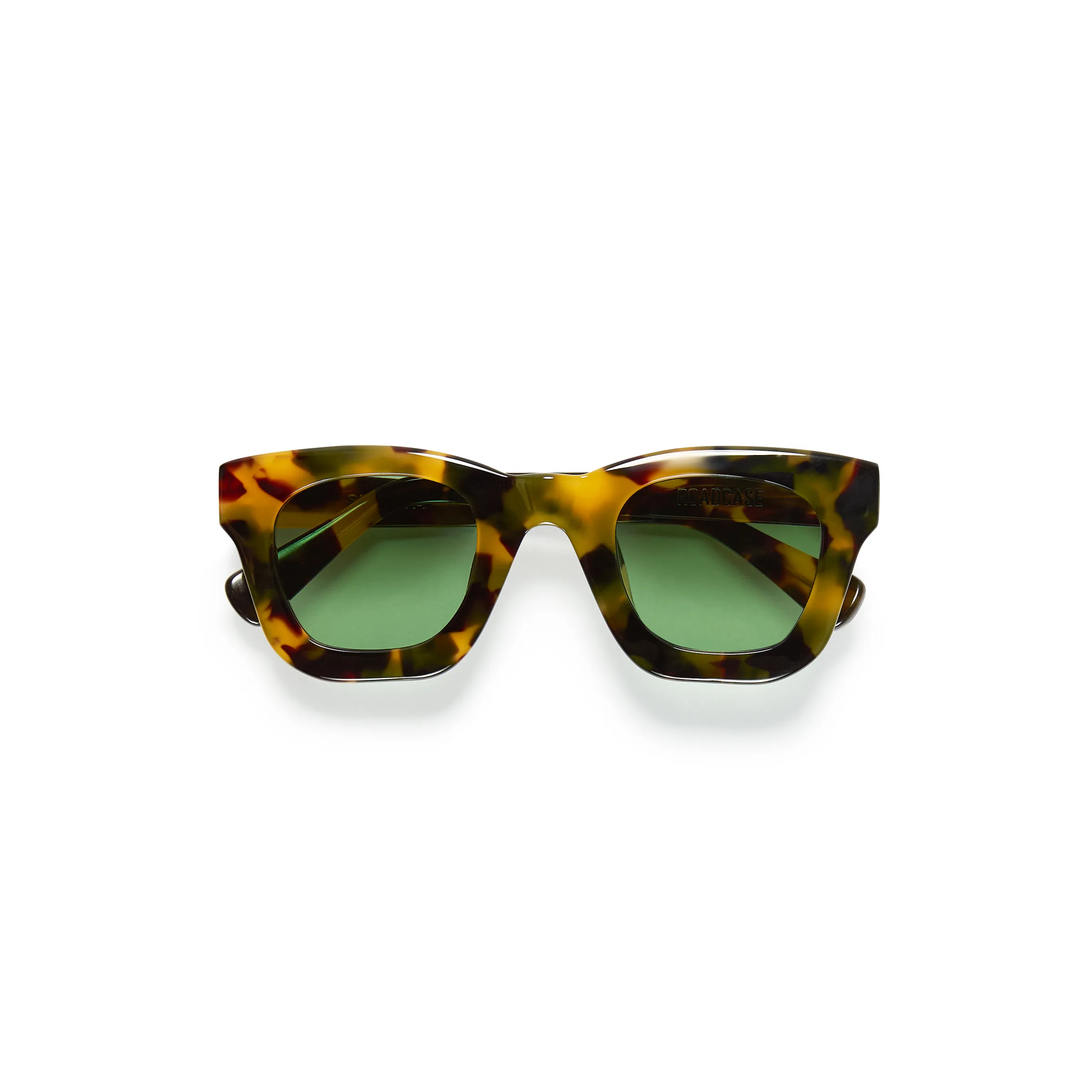 Chunky tortoiseshell acetate sunglasses with green lenses, folded on a white background, for Strata.