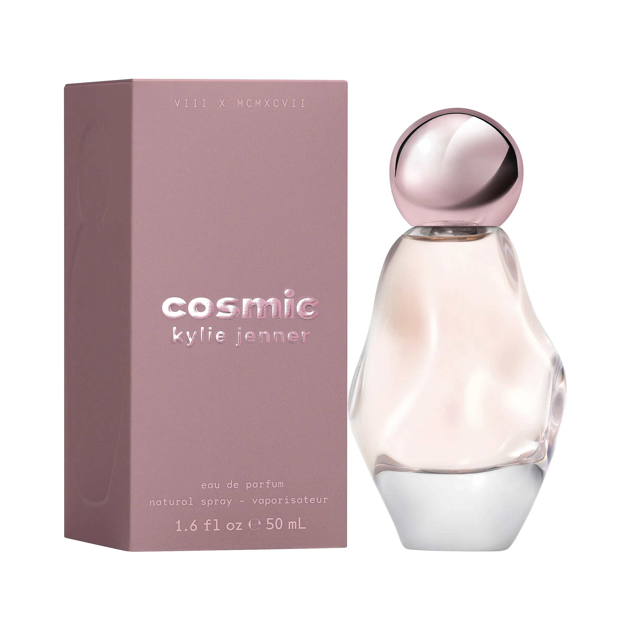Cosmic eau de parfum in a sculpted pink glass bottle beside its mauve box on white, for Kylie Cosmetics.