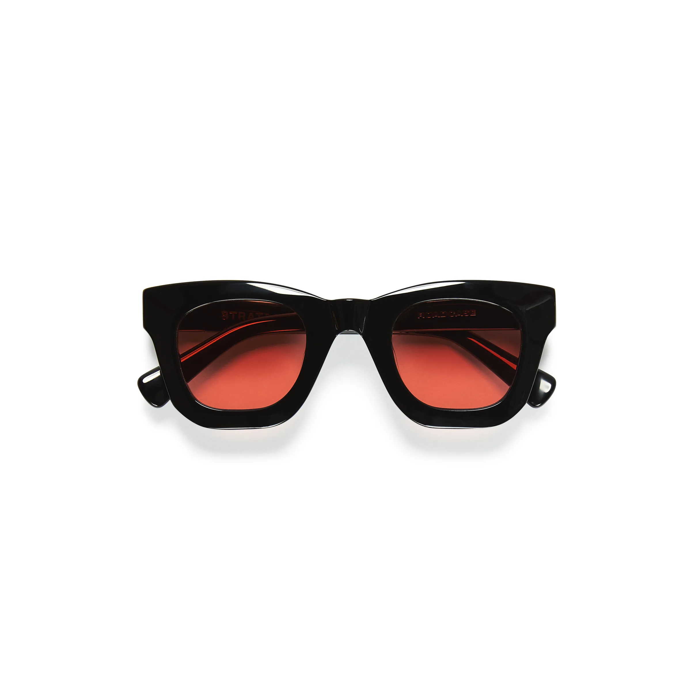 Black acetate Roadcase sunglasses with rose-tinted lenses, folded flat on a white background, for Strata.