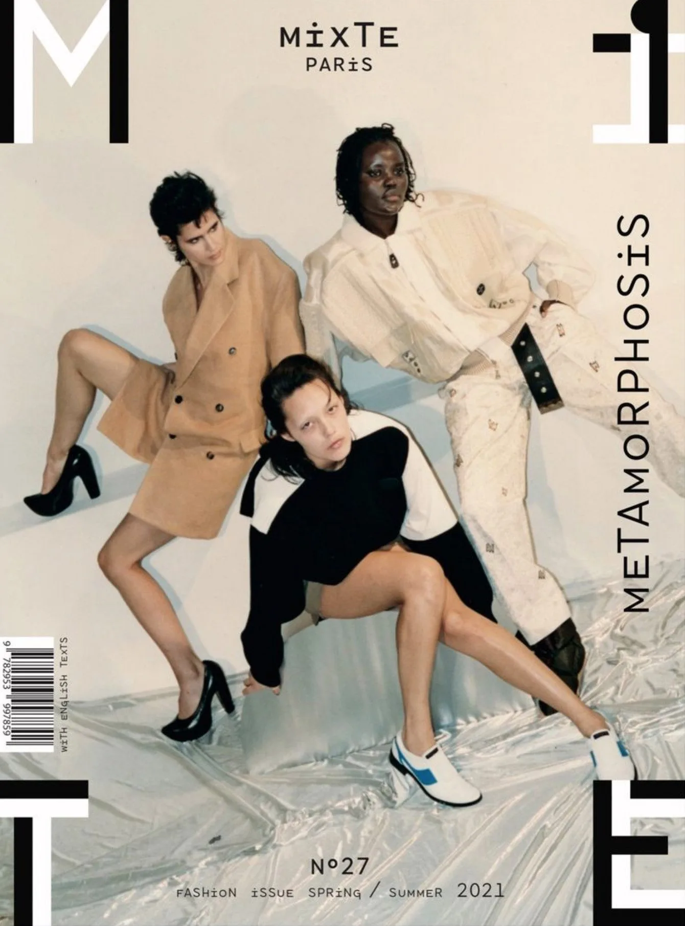 Magazine cover of three models in tailored outfits posing on silver plastic sheeting, Spring/Summer 2021 issue, for Mixte.