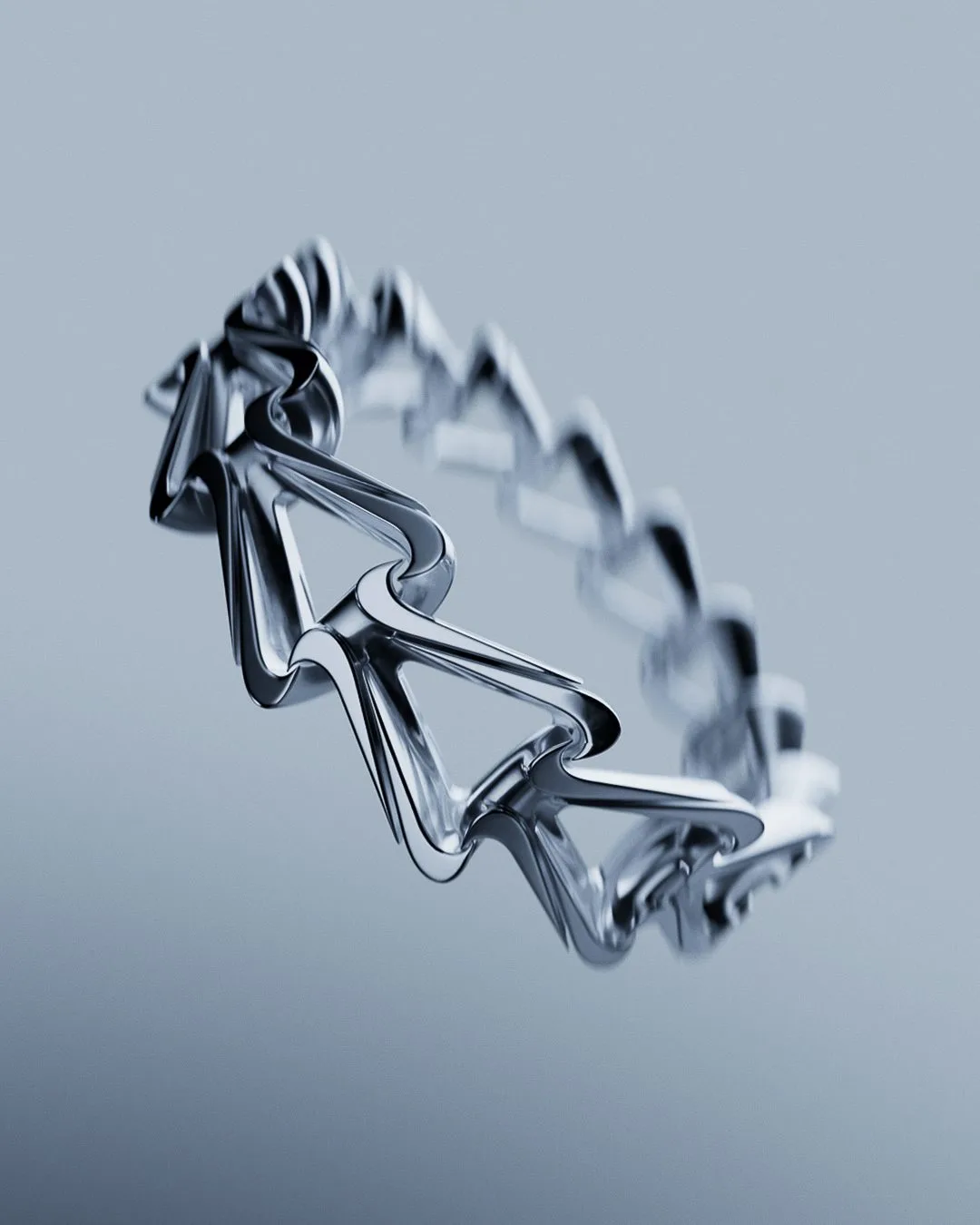 CGI render of a chrome wristband made of linked swoosh shapes floating against a pale blue-grey backdrop, for Nike.