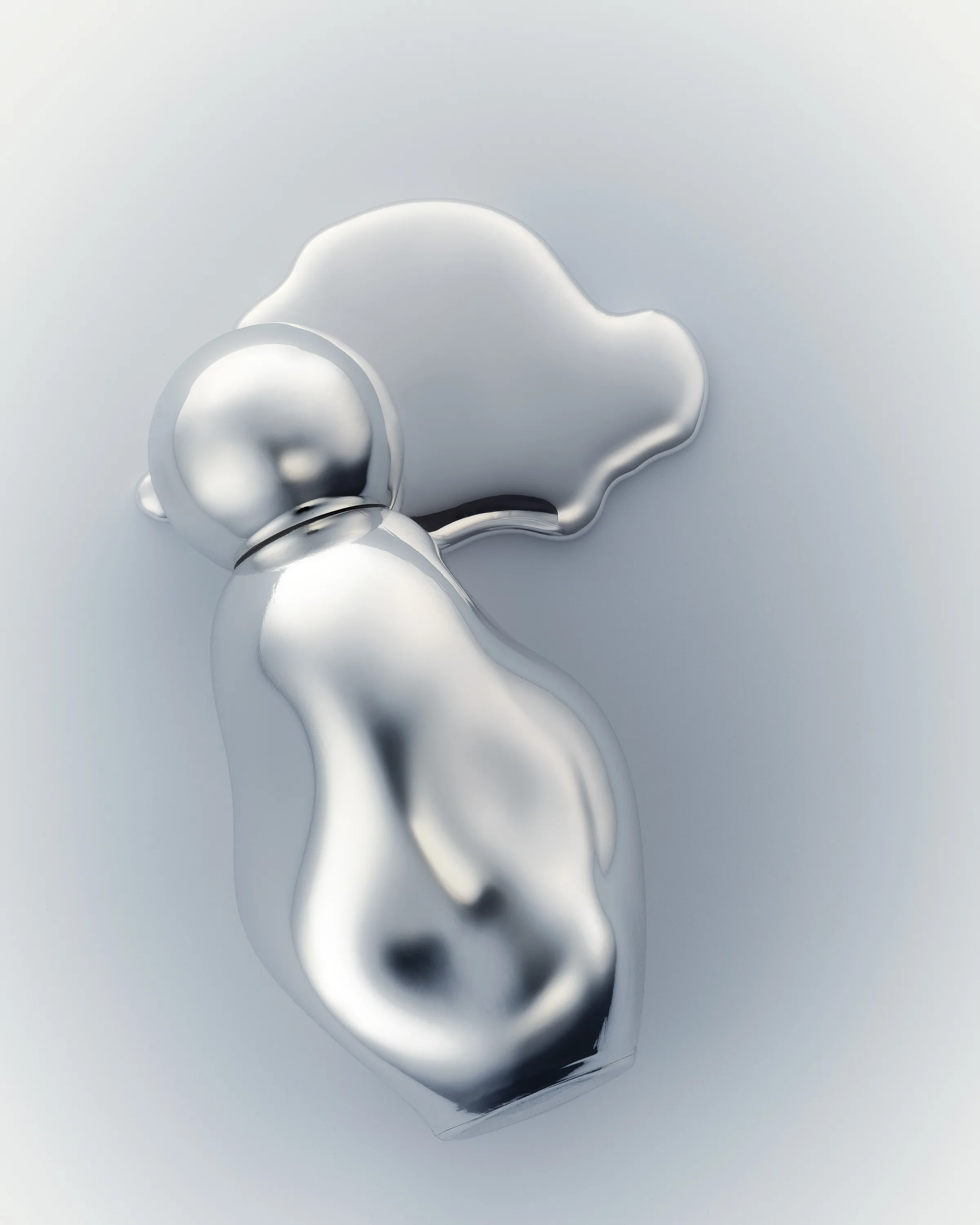 Melted chrome perfume bottle with a round cap beside a liquid silver puddle on a pale grey background, for Kylie Cosmetics.