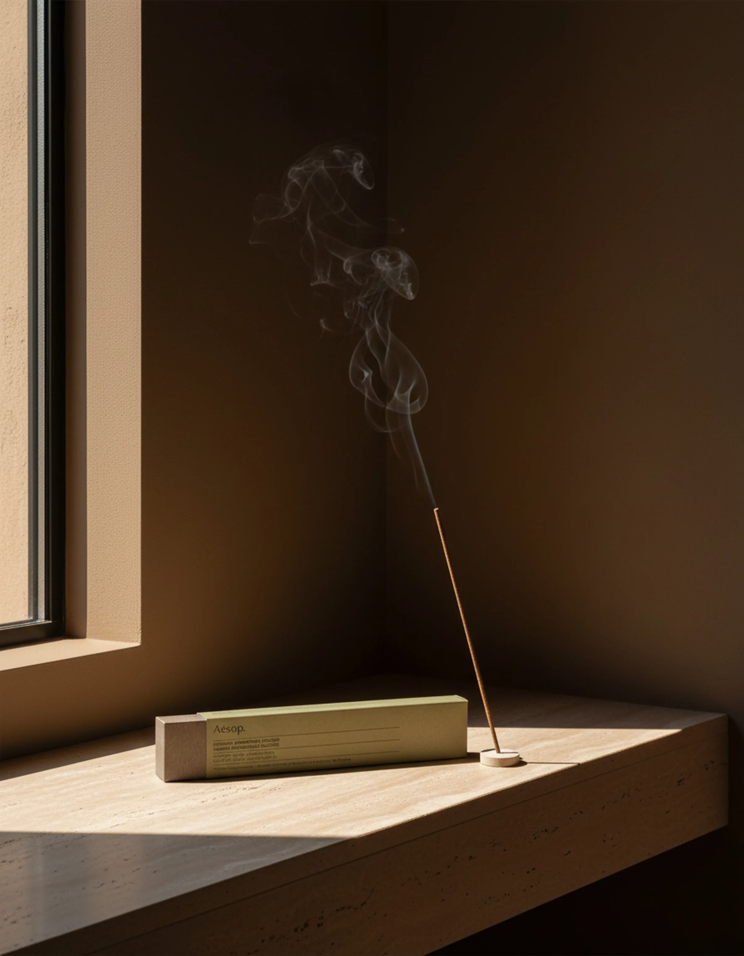 AI image of a lit incense stick beside its green box on a sunlit travertine window ledge. Aesop AI Concept.
