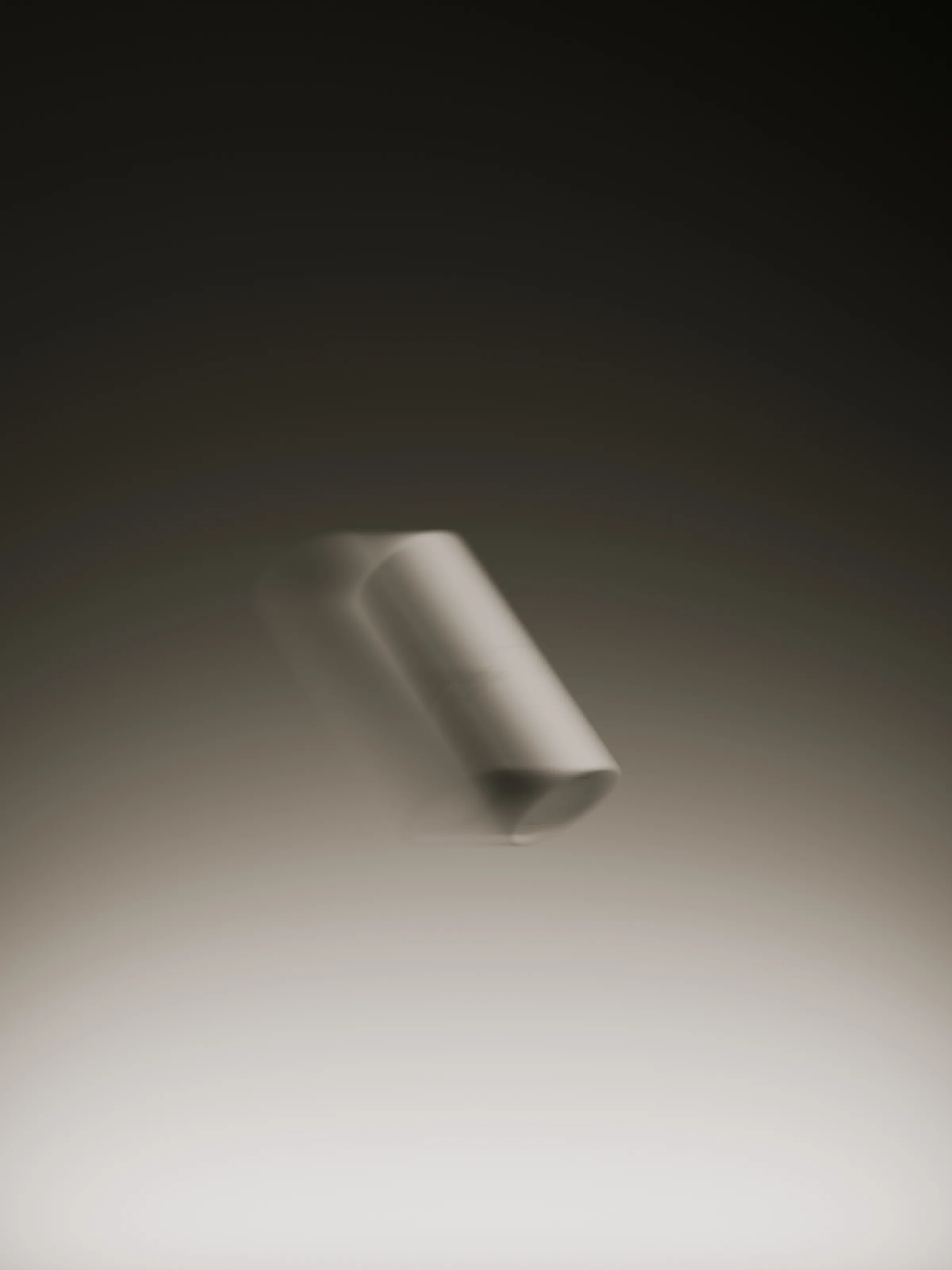 CGI render of a white cylindrical product floating with motion blur against a dark-to-light gradient, for Talgh.
