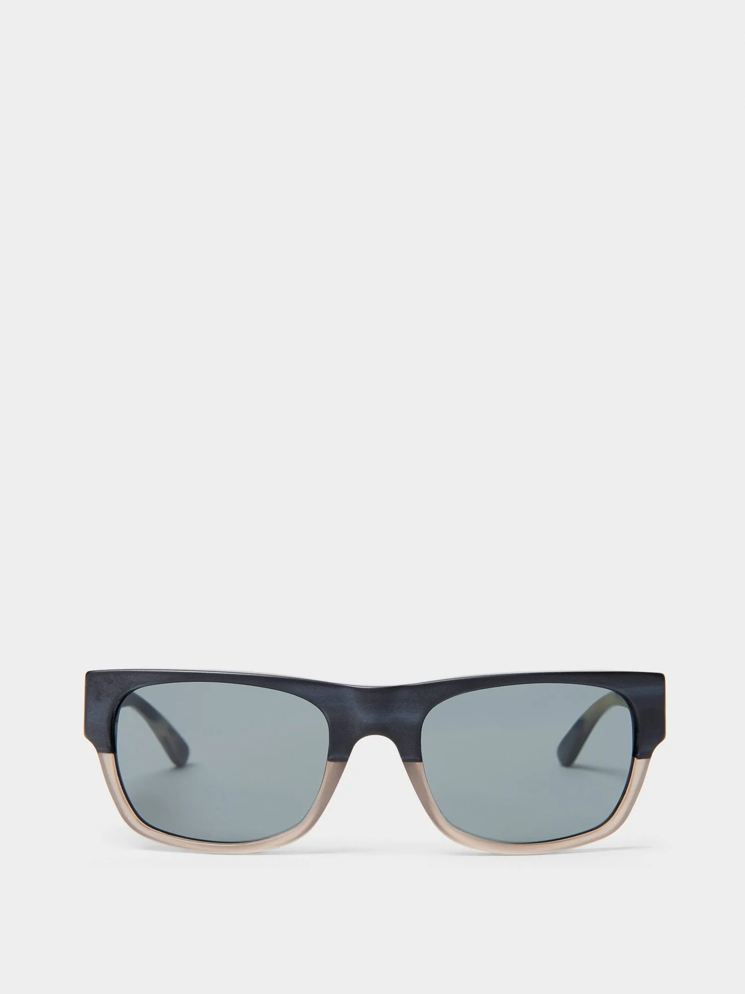 Rectangular sunglasses with navy-to-clear two-tone frames and grey lenses on a white background, for DKNY.