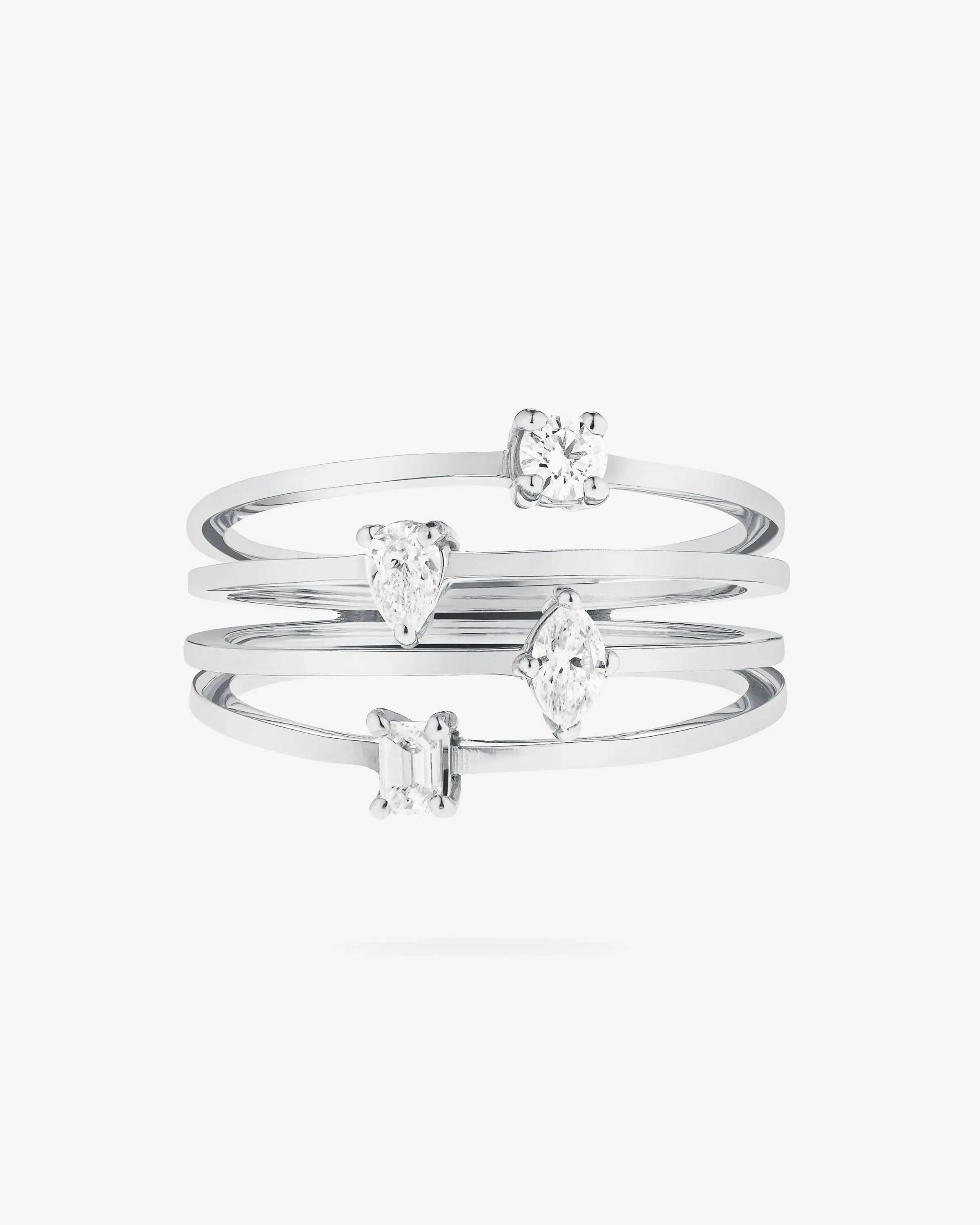 White gold four-band ring set with round, pear, marquise and emerald-cut diamonds on white, for Lana Jewelry.
