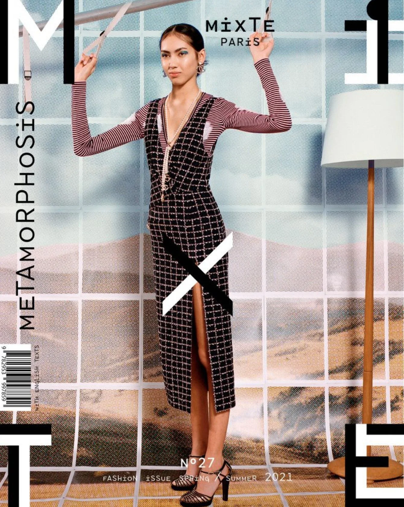 Magazine cover of a model in a black tweed slit dress and striped top before a painted landscape backdrop, for Mixte.