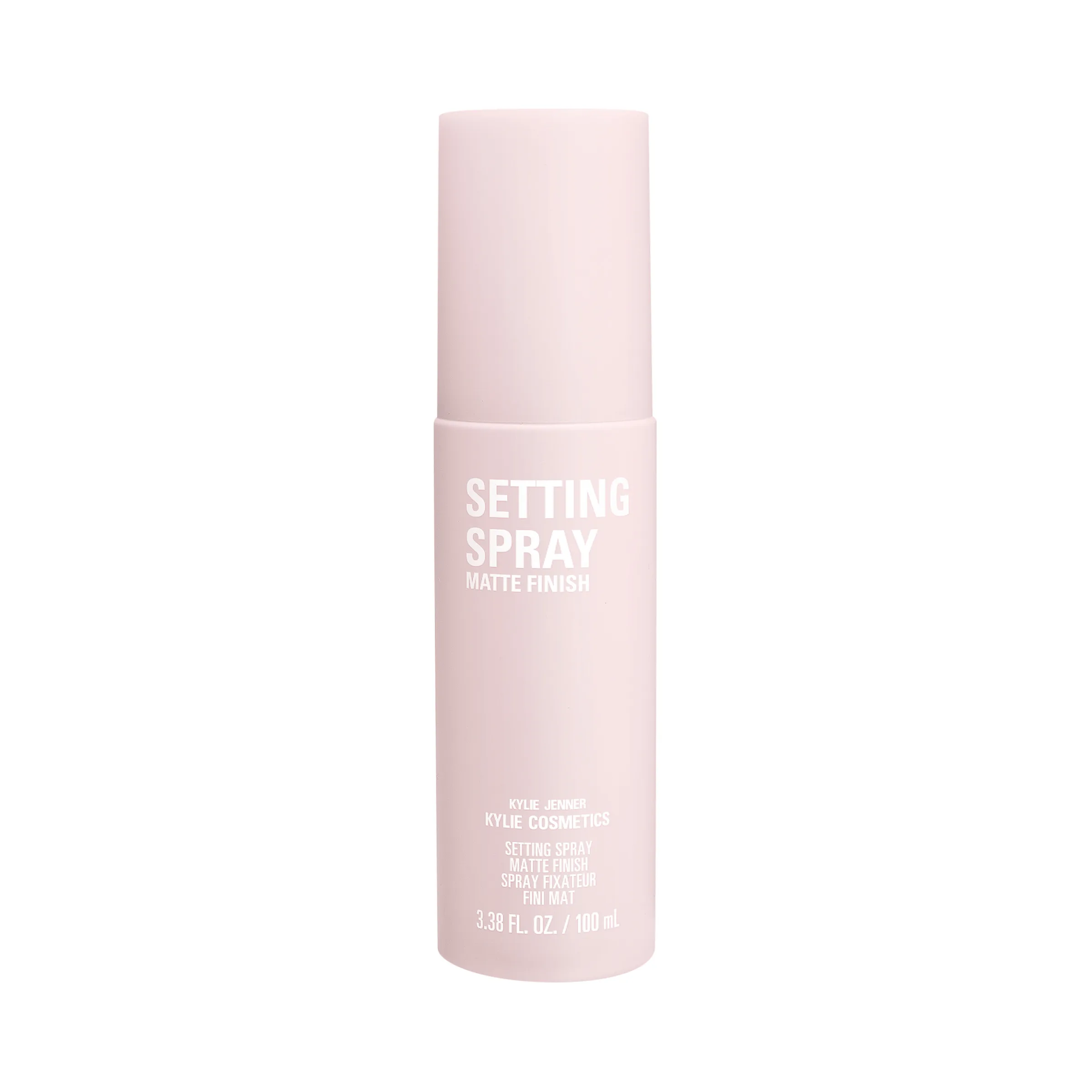 Pale pink matte finish setting spray bottle with white lettering on a white background, for Kylie Cosmetics.