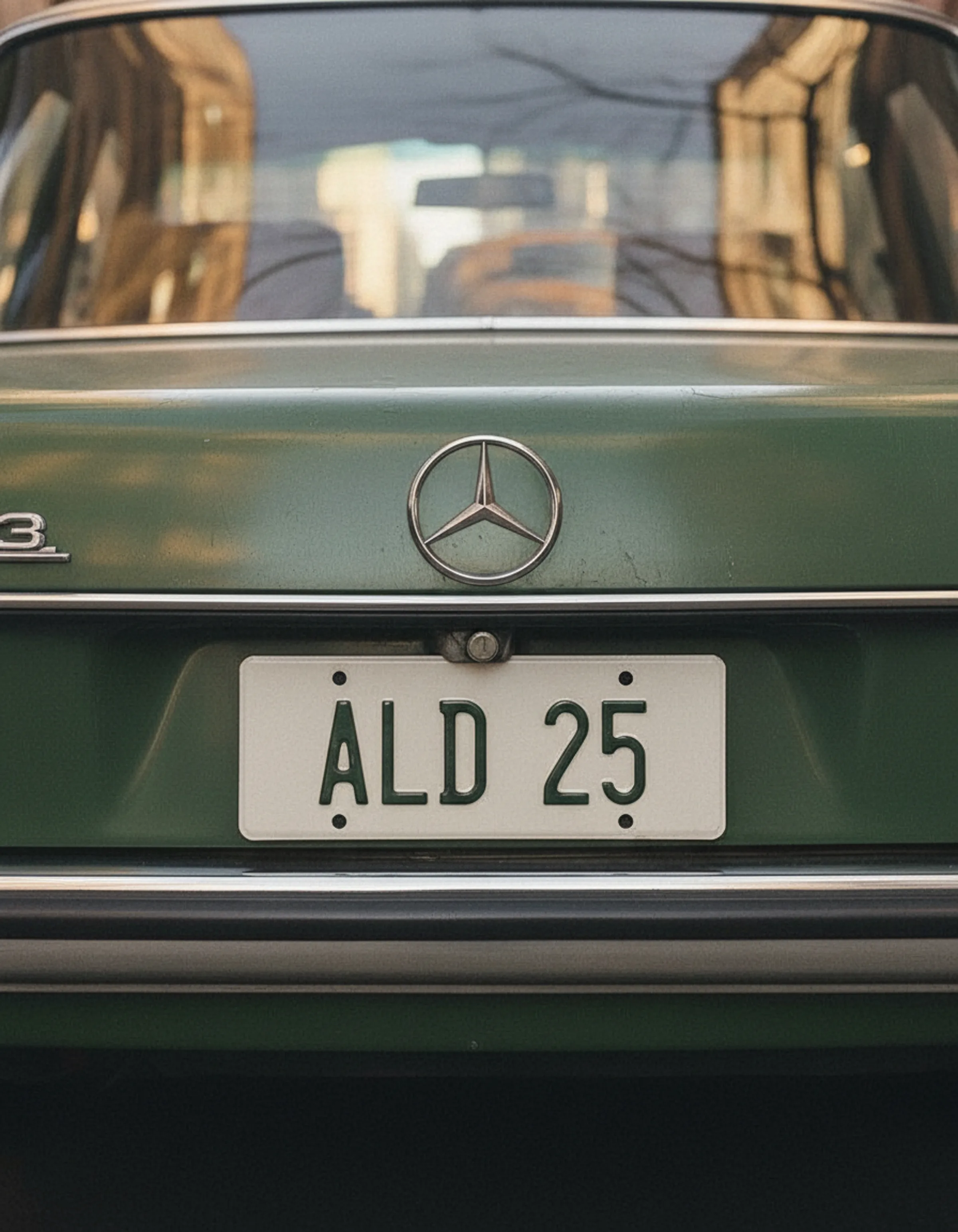 AI image of the rear of a vintage green Mercedes sedan with an ALD 25 licence plate. Aime Leon Dore AI Concept.