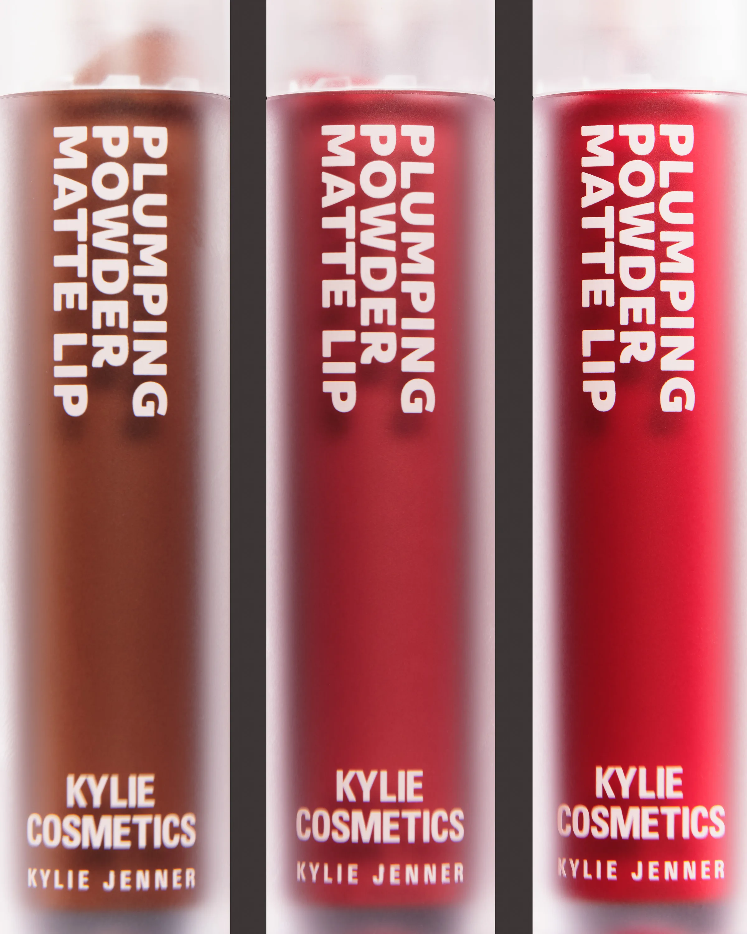 Three Plumping Powder Matte Lip tubes in brown, berry and red, shown close up behind frosted glass, for Kylie Cosmetics.