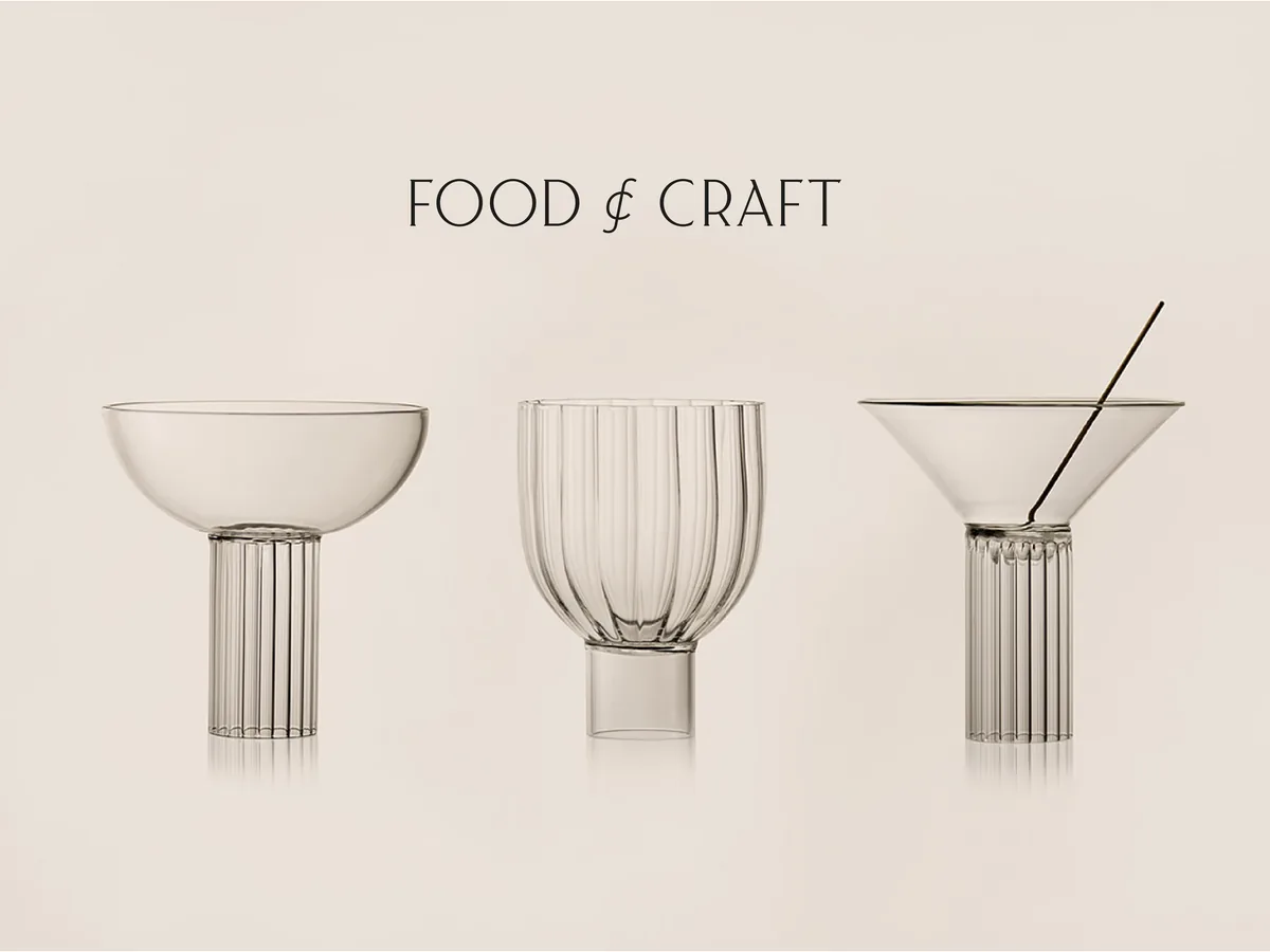 Three clear fluted glasses, a coupe, tumbler and martini glass, on a beige backdrop under the wordmark, for Food & Craft.