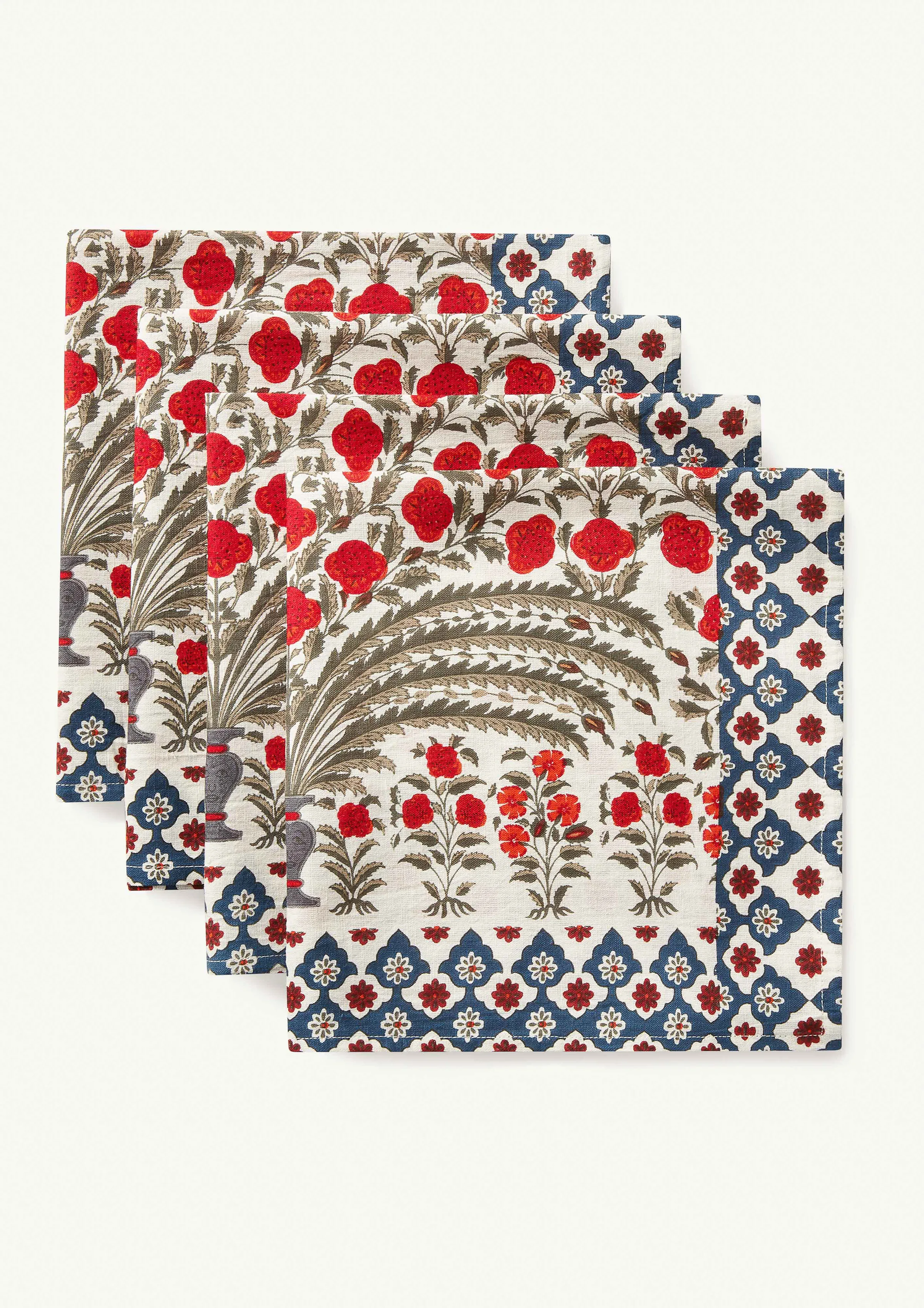Set of four block-printed napkins with red flowers, palm motif and blue lattice border on white, for Rhode.