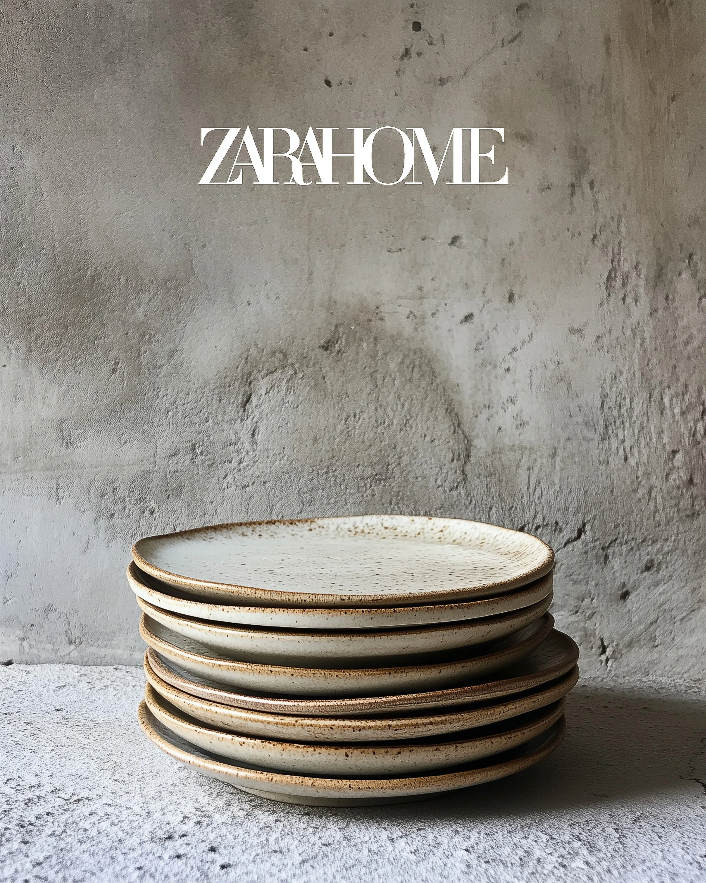 AI image of stacked speckled cream stoneware plates against a weathered concrete wall. Zara Home AI Concept.